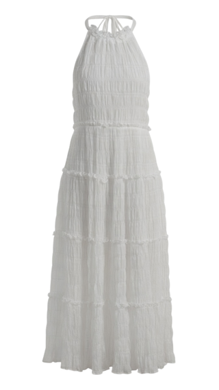 White halter neck dress with tiered layers on a white background
