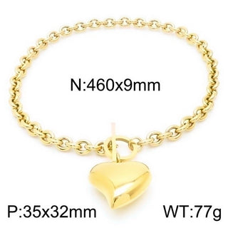 Gold chain bracelet with a heart-shaped pendant on a white background