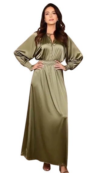 Woman wearing a long olive green dress on a white background